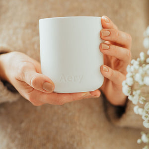 white ceramic luxury candle by aery