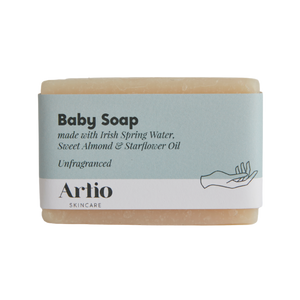 unfragranced baby soap bar by artio skincare in a blue and white cardboard packaging on a white background